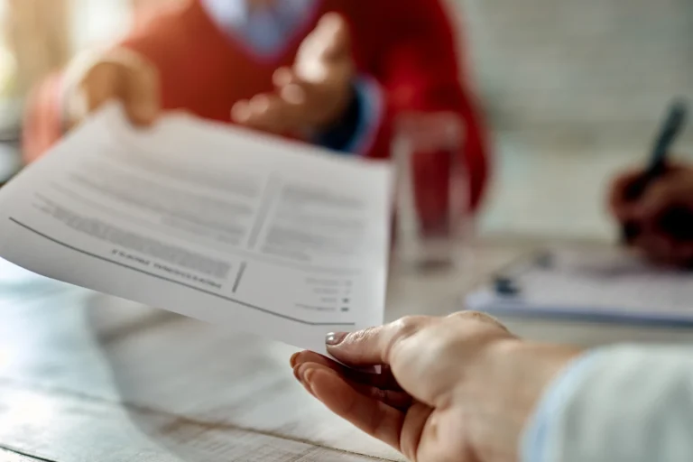 Expat handing a resume to a company in downtown Montreal